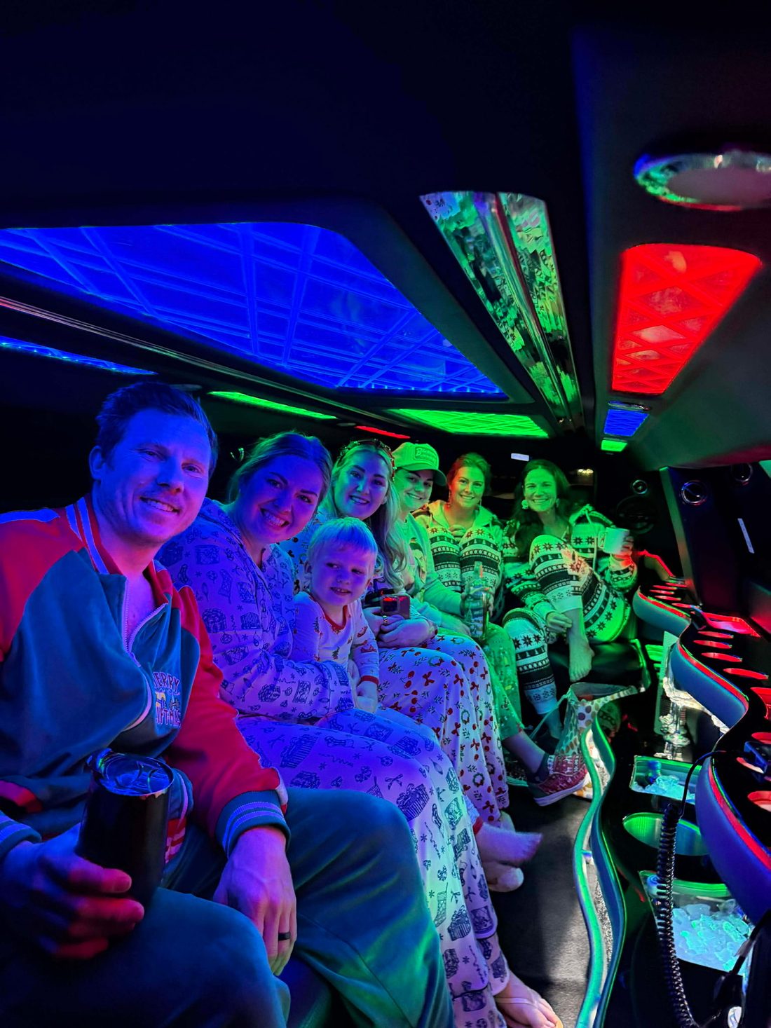 Family in matching pajamas inside the party bus