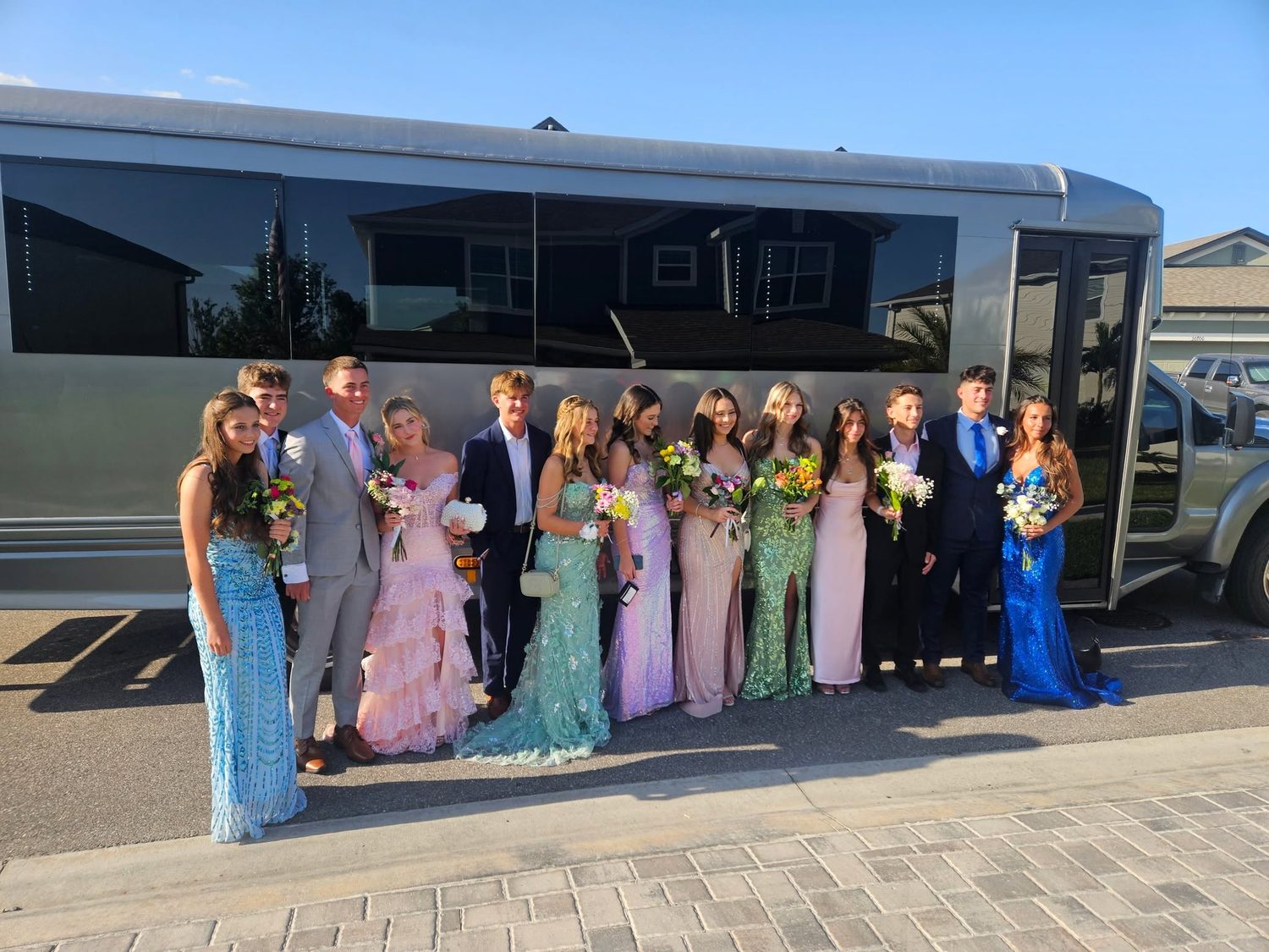 Big group lined up by the party bus